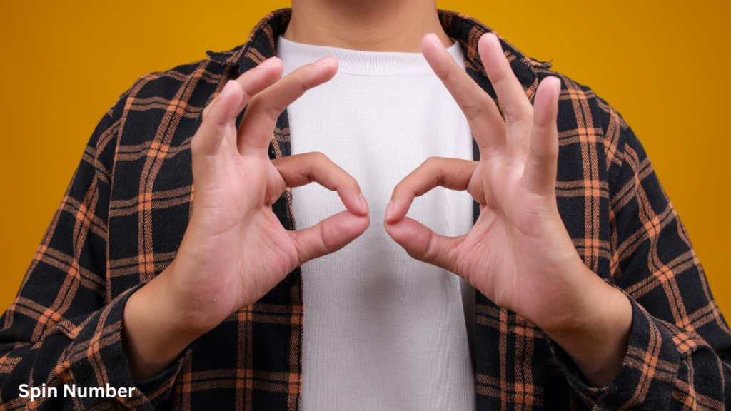A person wearing a plaid shirt making double circles with their hands over their eyes to mimic binoculars during a game of Charades Ideas.