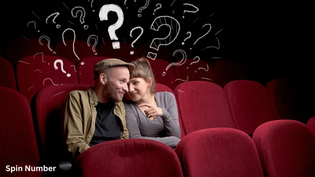 A man and woman whispering intimately in red theater seats beneath a digital background graphic filled with floating chalk question marks, ideal for ice-breaking Questions for Couples.