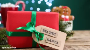 A red Christmas present wrapped with a vibrant green satin bow and a brown paper gift tag stamped with "SECRET SANTA," perfect for a blog post about a secret santa generator.