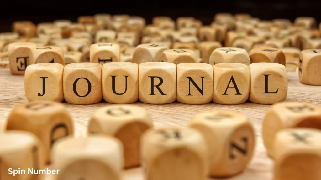 A close-up shot of wooden dice blocks spelling out the word "JOURNAL", representing medium-length Hangman Words.