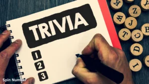 A close-up of a person writing in a spiral notebook labeled "TRIVIA" next to a numbered list, preparing a set of Trivia Questions.