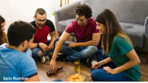 Group of friends playing spin the bottle and asking Truth or Dare Questions